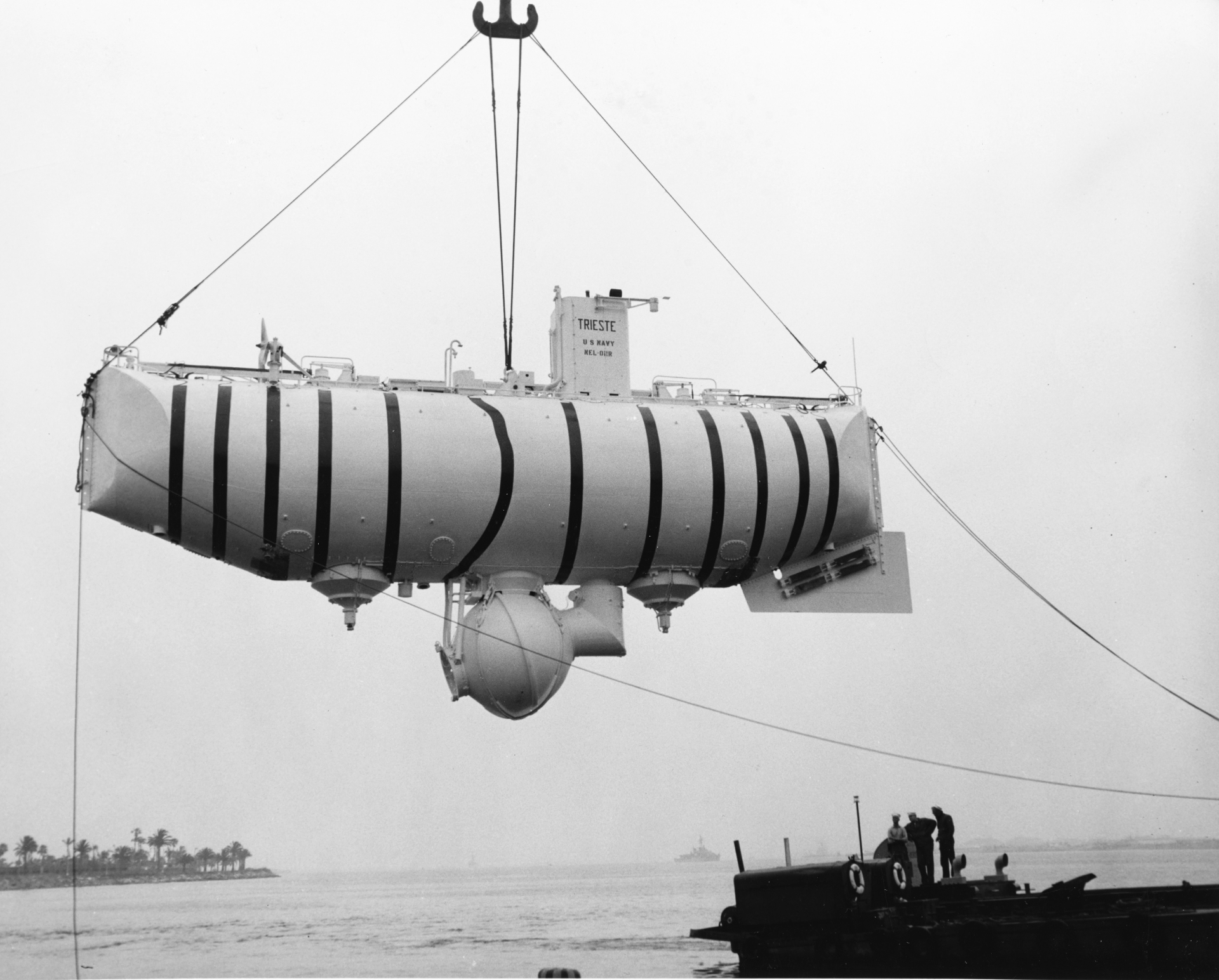 The bathyscaphe Trieste, suspended before one of the great technical adventures of the twentieth century.